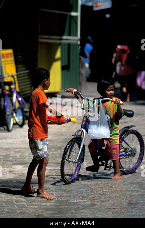 Children play games in the streets of Thailand Stock Photo