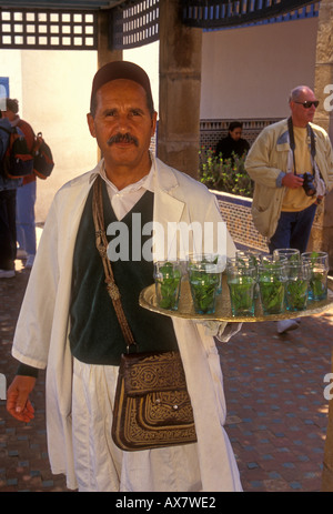 Moroccan, man, waiter, holding tray of mint tea, Cafe Maure, Kasbah des Oudaias, city of Rabat, Morocco Stock Photo