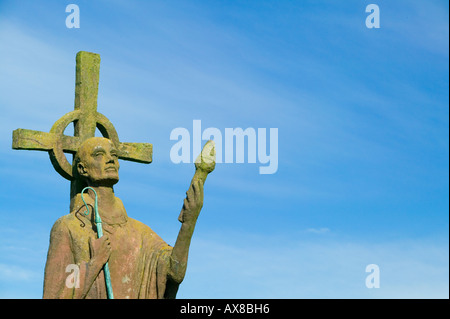 Statue of St Aidan in the grounds of the Parish Church of St Mary the Virgin, Holy Island, Northumberland, England Stock Photo