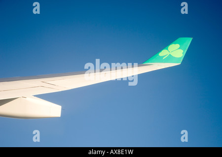 Aer Lingus commercial jet airliner wing in flight Stock Photo