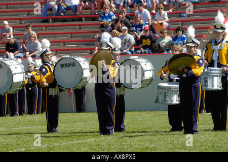 American High School Marching Band performs during the halftime of a football game Stock Photo