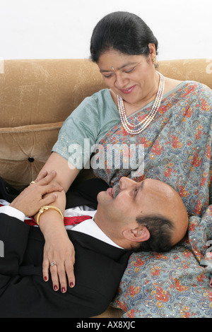 Senior couple romancing at home Stock Photo