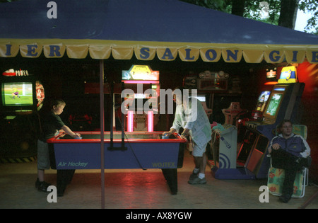 Father and son playing table ice hockey in a game saloon in Miedzyzdroje, Poland Stock Photo