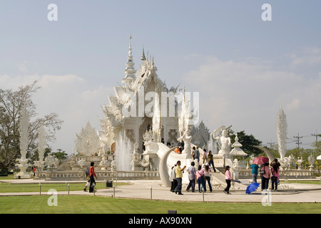 Wat Rong Khun Is a buddhist temple in Chiang Rai, Thailand, well-know and impressive temple with all white color. Stock Photo