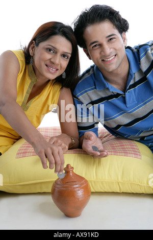 1 indian Woman Saving Money Piggy Bank Stock Photo - Alamy