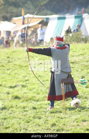 medieval english archer about to loose an arrow  battle of hastings east sussex england Stock Photo