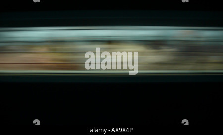 The abstract blur at night from a moving Indian train carriage between Bangalore and Hyderabad, India. Stock Photo