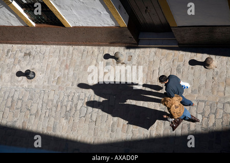 Aerial view of a couple walking on the street, Seville, Spain Stock Photo
