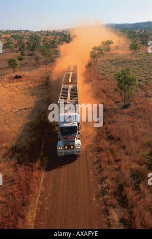 aerial view of livestock truck, triple-trailer driving on dirt road, Kimberley, Western Australia Stock Photo