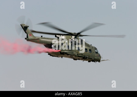 RAF Merlin HC3 trailling red smoke RIAT 2005 RAF Fairford Gloucestershire England UK Stock Photo