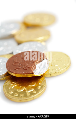 Chocolate money eating your savings Stock Photo