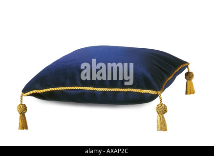 One Royal rich silk fabrics luxurious cushion deep blue color with expensive gold tassels on white background Stock Photo