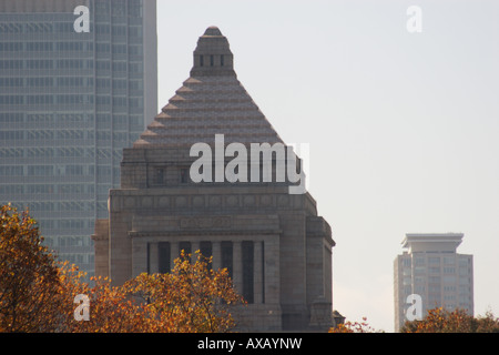 The National Diet building or Parliament building of Japan in Nagatachō Tokyo with Autumn trees surrounding it. Tokyo, Japan Stock Photo