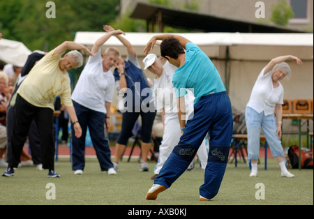 Elderly women doing outdoor gymnastics Stock Photo