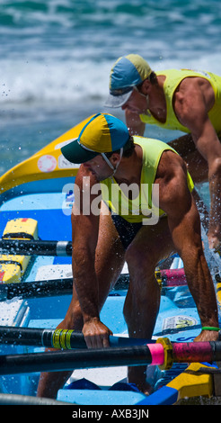 jumping into surfboat Stock Photo