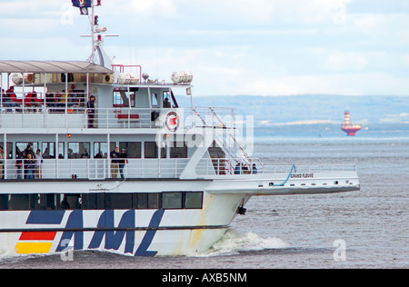 'Croisières AML' whale watching cruising ship on the Saint Lawrence river with 'haut-fond Prince' lighthouse in background Stock Photo