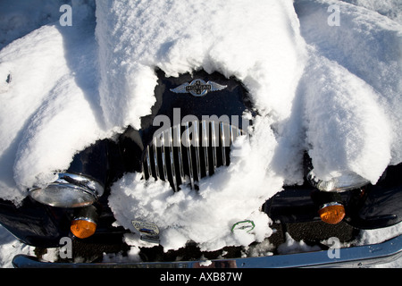 Radiator Grill of a Morgan Sports Car covered in snow Stock Photo