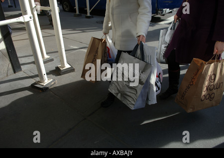 Women with shopping bags in Midtown Manhattan Stock Photo