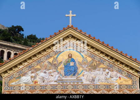 A Christian cross of sits atop a religious mosaic on the Cathedral of Saint Andrew in Amalfi, Campania, Italy Stock Photo