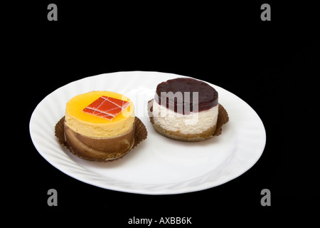 fancy cakes on the white plate Stock Photo