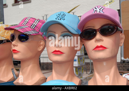 three mannequin heads wearing caps Stock Photo