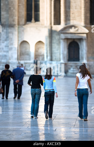 Young girls passegiata in Piazza del Popolo Ascoli Piceno Abruzzo Italy Stock Photo