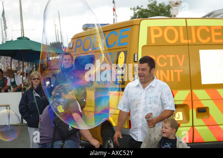 comedy clown giant bubble blower balloon creator Stock Photo