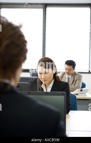 Three people working in office Stock Photo