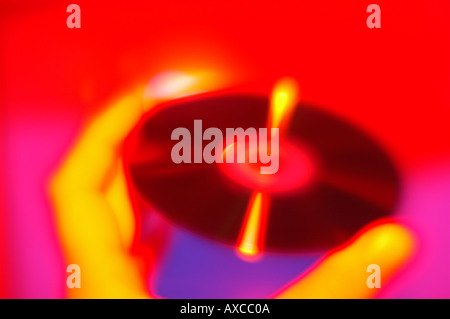 stylized computer disc in hand bold red color Stock Photo