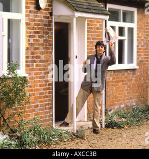 Paul McCartney waving 'Good Morning America' outside his Sussex farmhouse with newspaper & cup in hand 27 November 1980 PER0013 Stock Photo