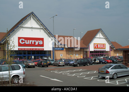 Ipswich Currys and PC World out of town center centre stores on retail park ample easy free car parking for customers Suffolk East Anglia England UK Stock Photo