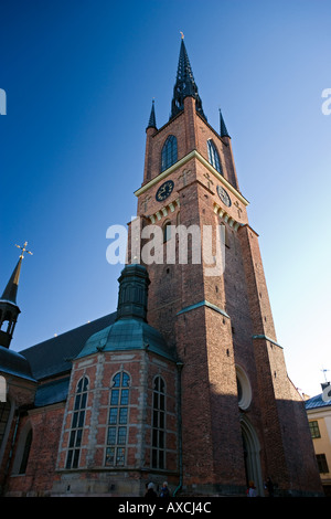 Riddarholm cathedral in Stockholm against a vibrant blue sky Stock Photo