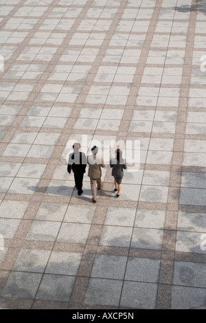 Three business people walking Stock Photo