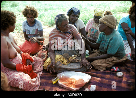 Emily Kame Kngwarreye famous aboriginal artist being painted for a women's ceremony at Utopia central desert Australia Stock Photo