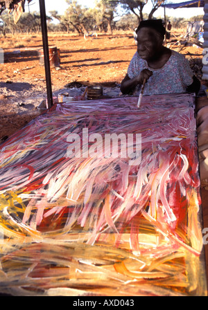 Emily Kame Kngwarreye famous Aboriginal artist painting one of her paintings at Utopia Central Australia Stock Photo