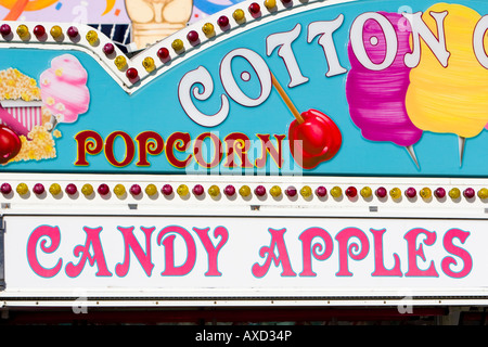 Popcorn and candy apples sign at carnival in USA Stock Photo