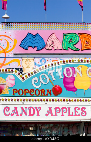 Popcorn and candy apples sign at carnival in USA Stock Photo