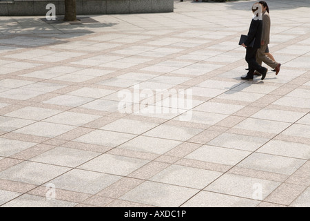 Three business people walking Stock Photo