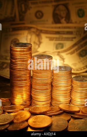 Stacks of Coins and Money US Dollars Growing Wealth and Investment Concept Golden color vertical Stock Photo