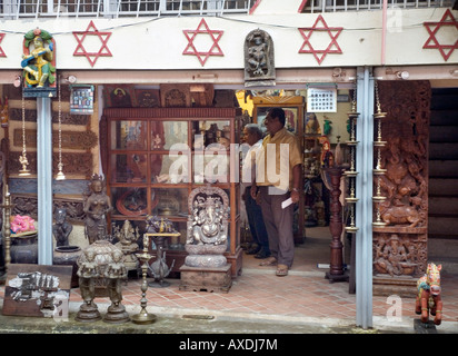 Small shop for tourists selling Hindu artifacts antiques and reproductions in Jew Town Kochi Cochin Kerala South India Stock Photo
