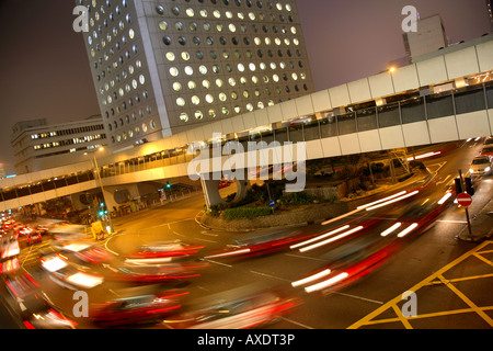 Connaught Road traffic piles past the Jardines building Central Hong Kong Stock Photo