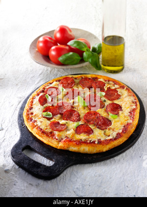 Italian authentic traditional thin crust topped pepperoni pizza Stock Photo