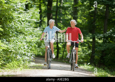 Senior couple biking Stock Photo