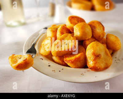 Roast Potatoes in a table setting Stock Photo