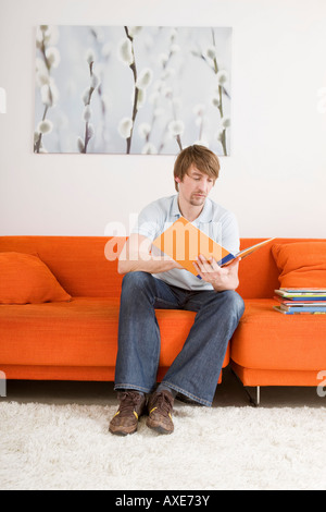 Young man reading a book Stock Photo