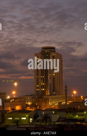 General view of the city of Tripoli by night showing the Al Fateh Tower Tripoli Libya Stock Photo