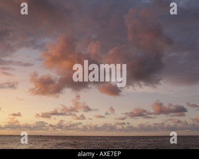 Sunset with pastel colored clouds in the sky at Choroni beach, Estado Aragua, Venezuela Stock Photo
