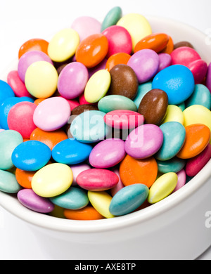 Candy covered chocolate sweets in a bowl close up Stock Photo
