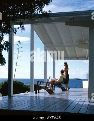 House on Channel Cay, Abacos Island, Bahamas. Verandah with couple. Stock Photo