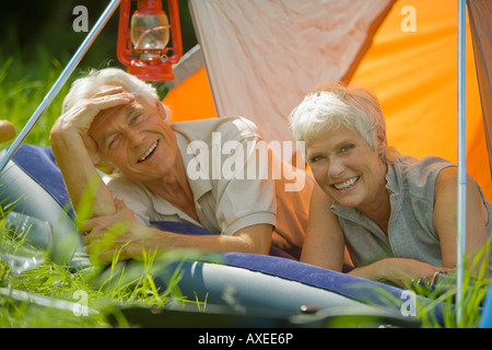 Senior couple relaxing in tent, portrait Stock Photo